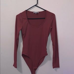 Plain pink colored body suit